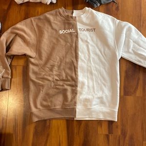 brown and white split sweater